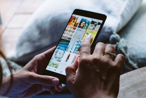 young-woman-browsing-instagram-on-mobile-phone